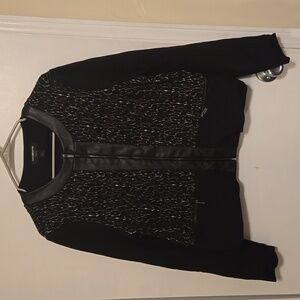 Vintage black jacket accented with faux leather.